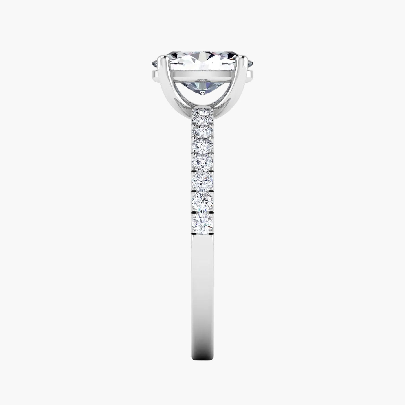 Diamond ring with a central gemstone and smaller stones on a white background
