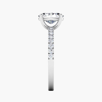 Diamond ring with a central gemstone and smaller stones on a white background
