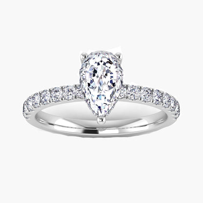 Diamond ring with a pear-shaped center stone on a white background