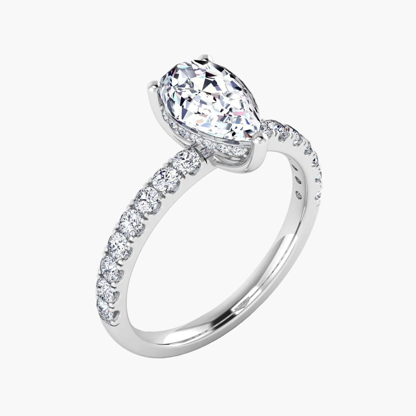 Diamond ring with a pear-shaped center stone on a white background