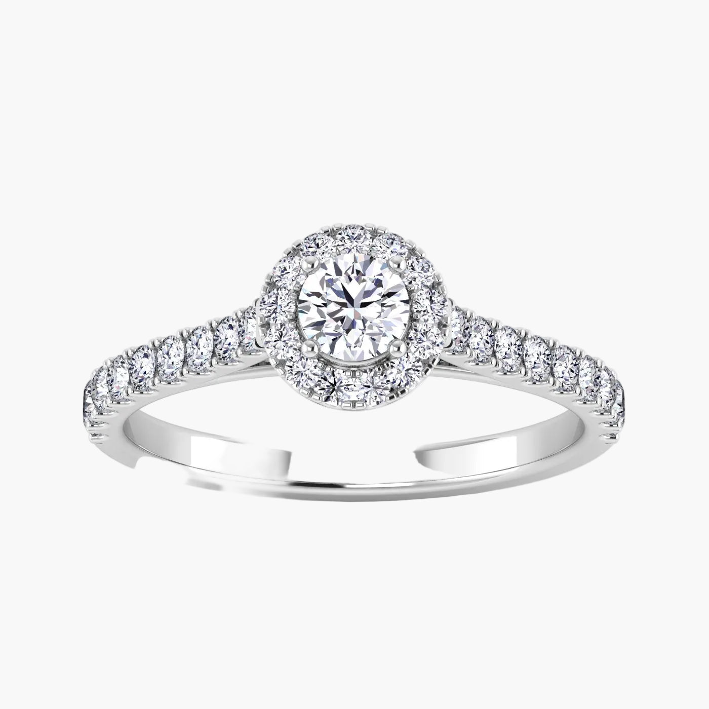Diamond ring with a halo and side stones on a white background