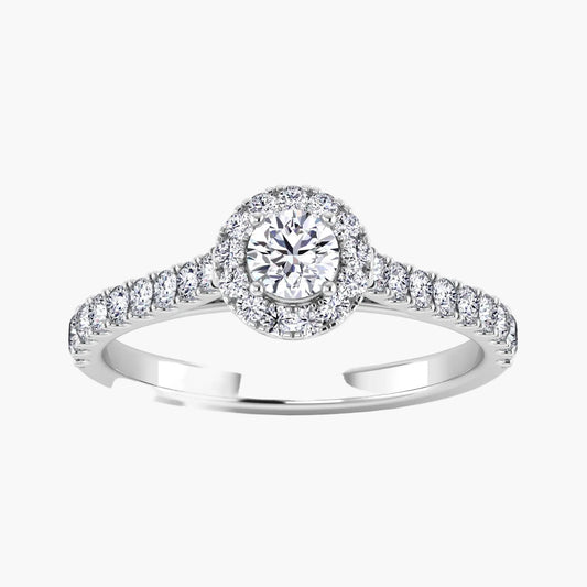 Diamond ring with a halo and side stones on a white background