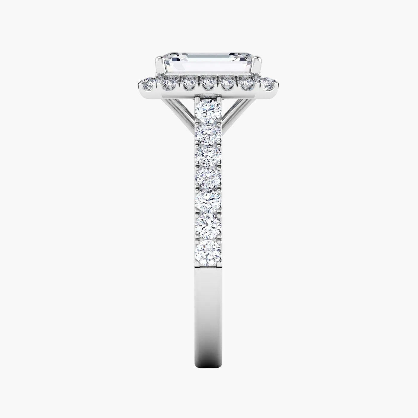 Diamond ring with a rectangular center stone on a white background