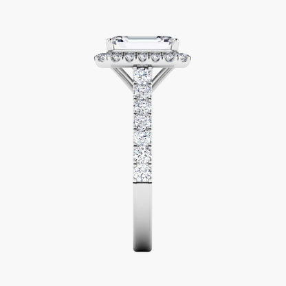 Diamond ring with a rectangular center stone on a white background