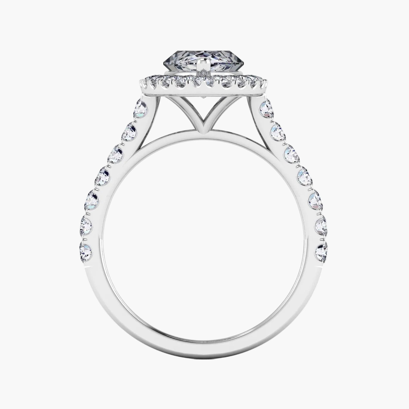 Diamond ring with a halo and round center stone on a white background