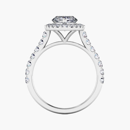 Diamond ring with a halo and round center stone on a white background