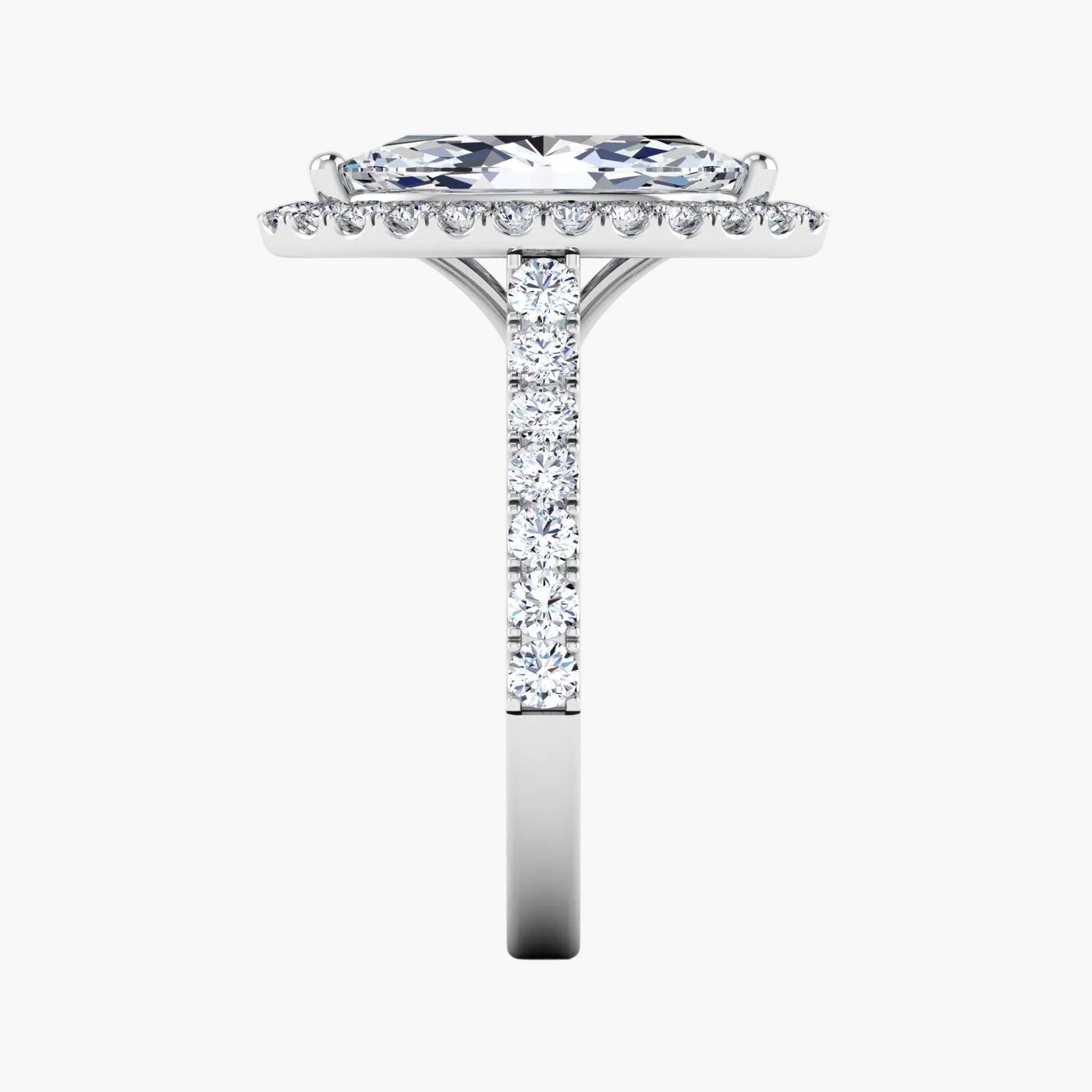 Diamond ring with a central stone and smaller stones on the band against a white background