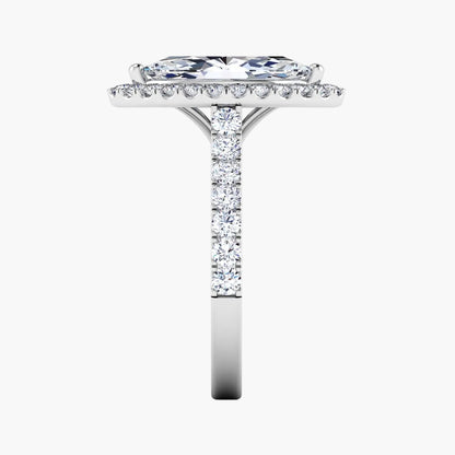 Diamond ring with a central stone and smaller stones on the band against a white background