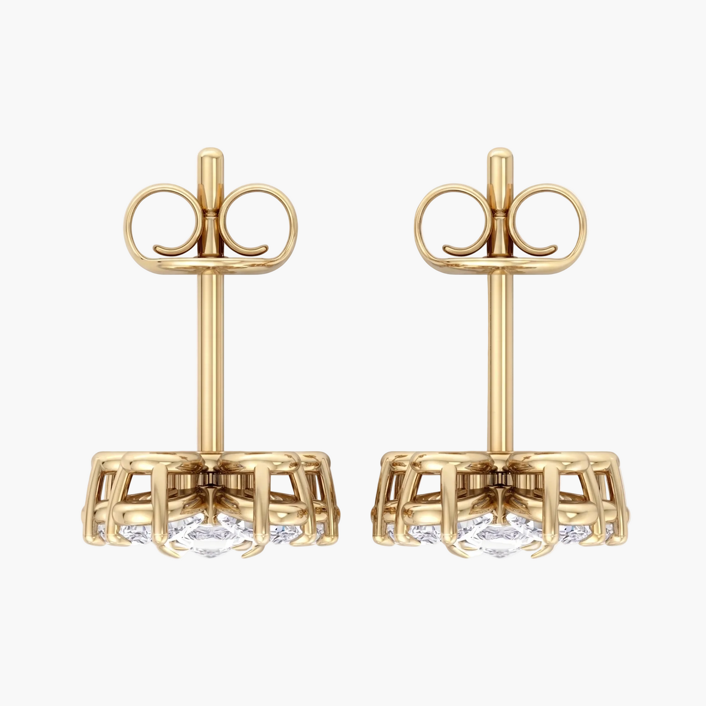 Gold earrings with clear gemstones on a white background