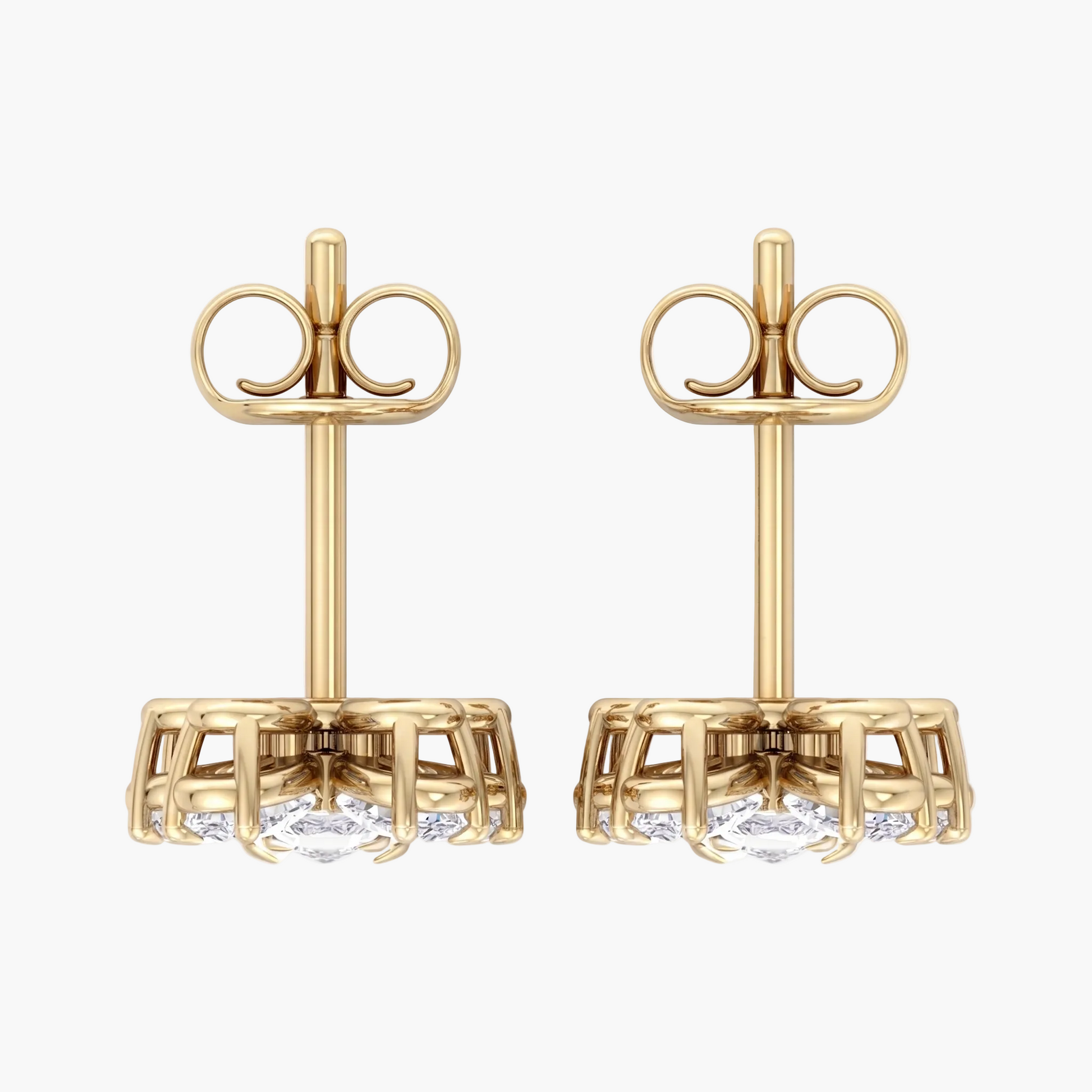Gold earrings with clear gemstones on a white background