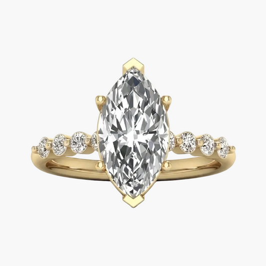 A yellow gold ring featuring a large marquise-cut diamond center stone with smaller round diamonds set along the shoulders, shown on a clean white background.