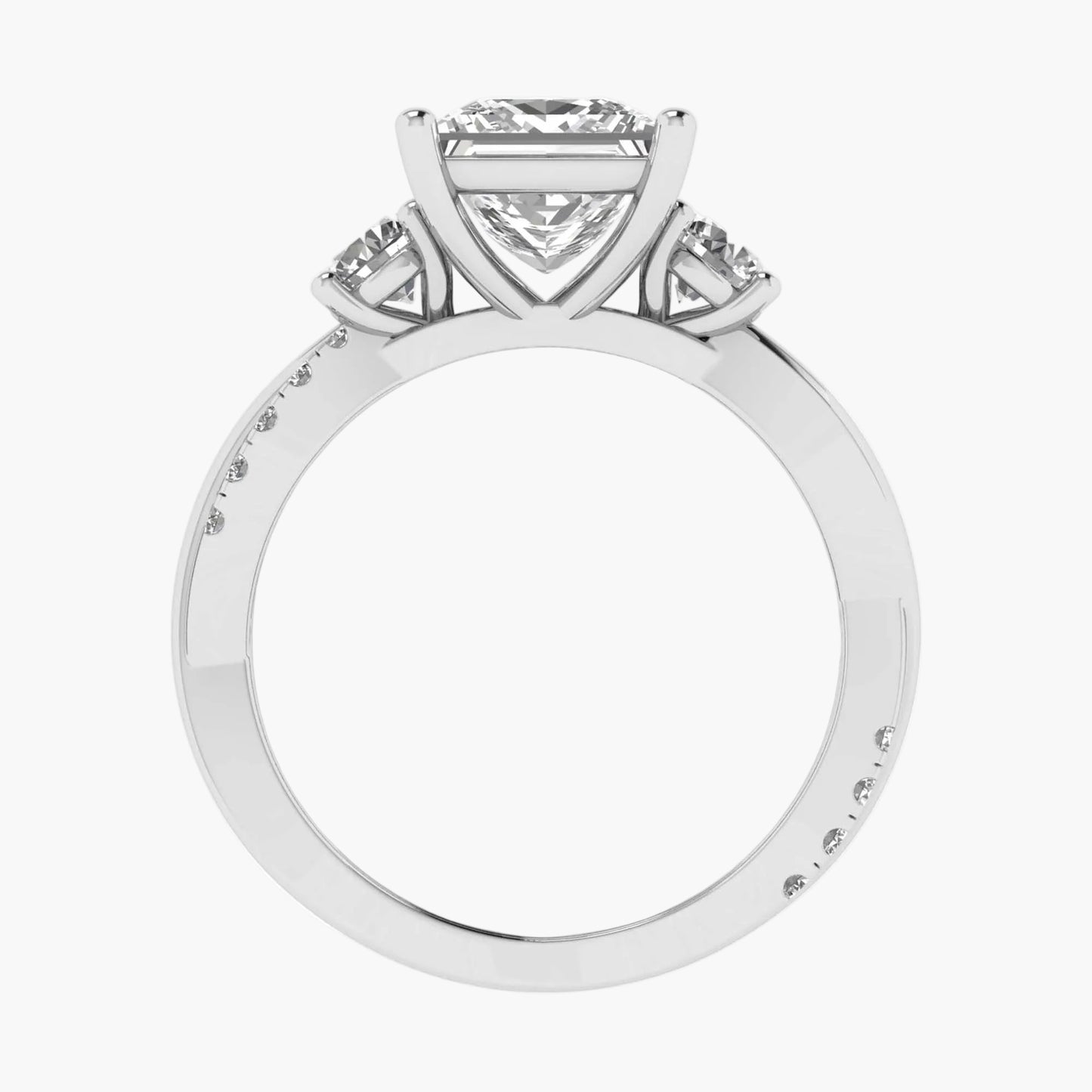 Diamond ring with a heart-shaped center stone on a white background