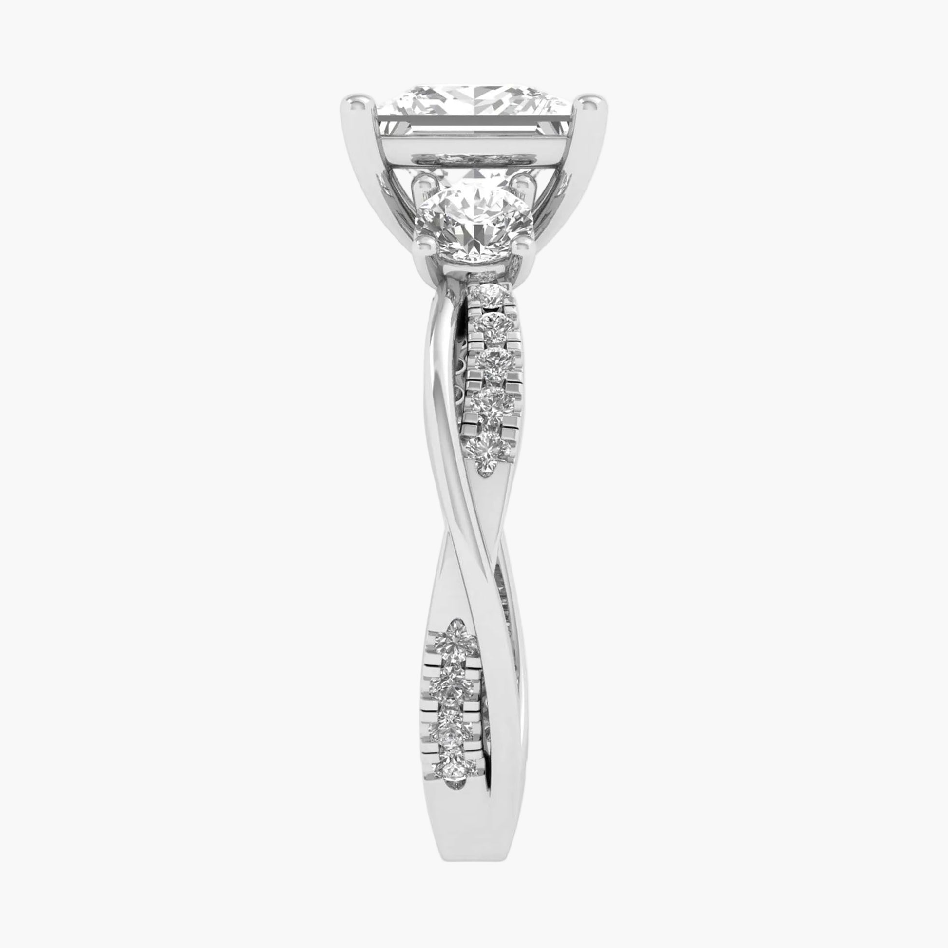 Diamond ring with a twisted design on a white background