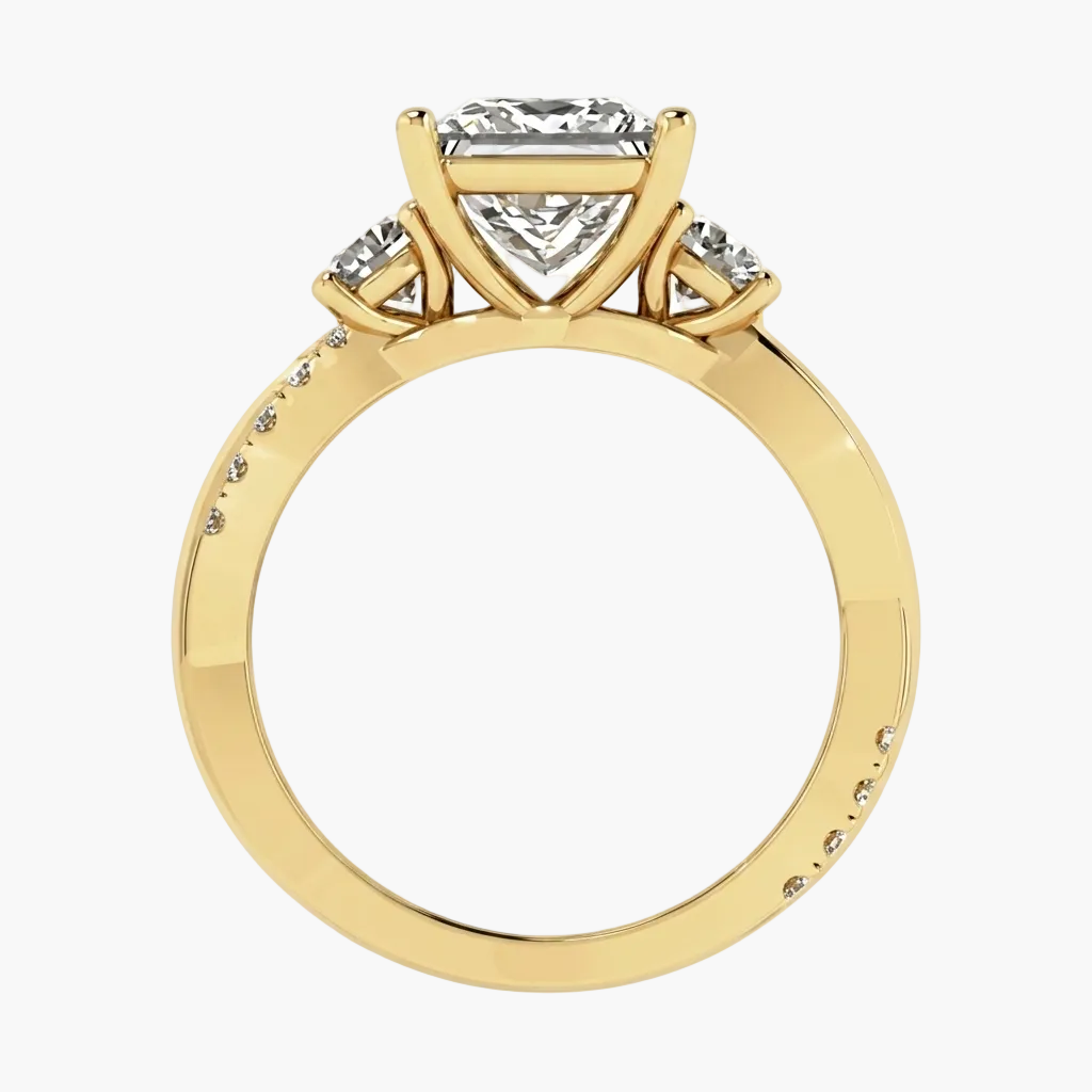Gold ring with a heart-shaped diamond on a white background