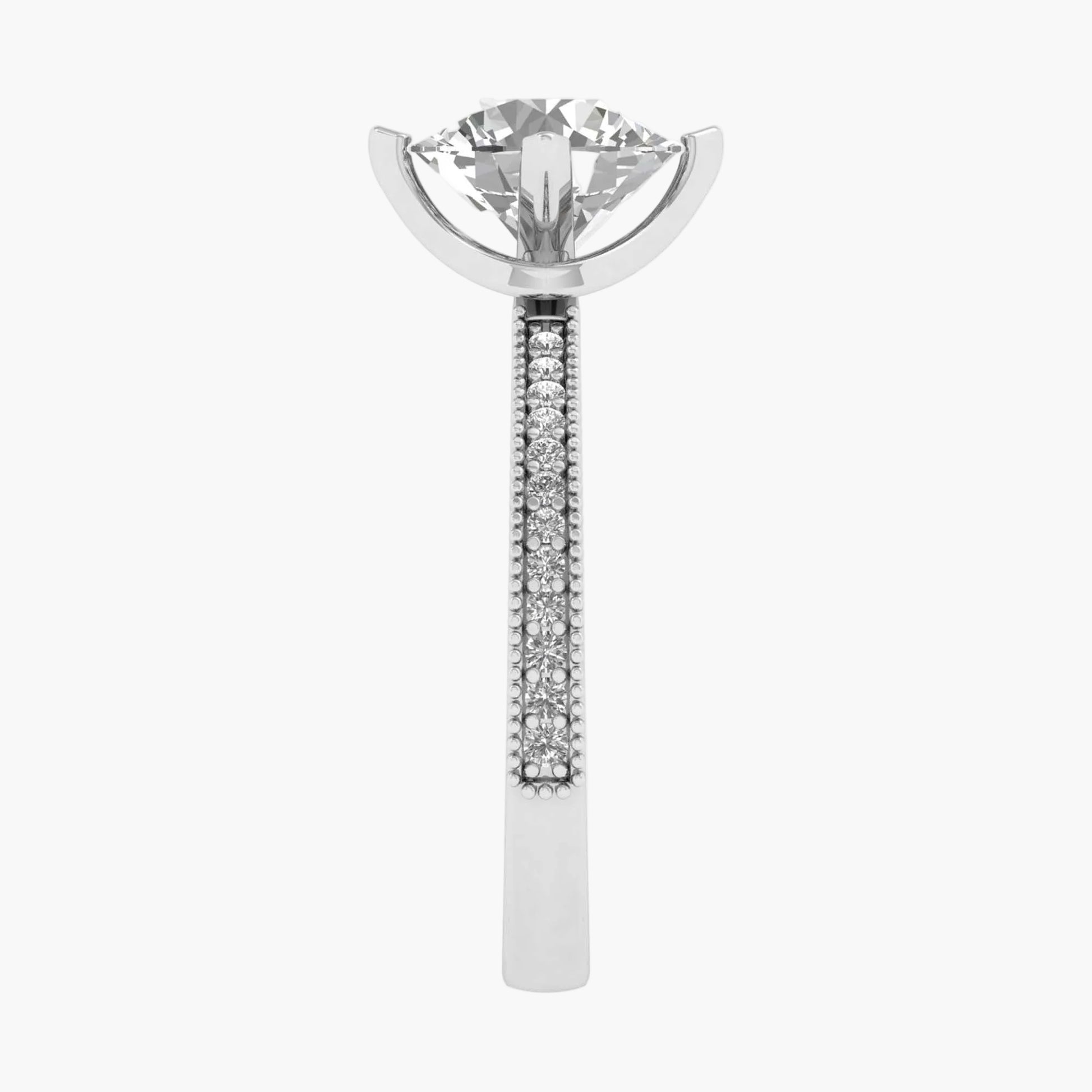 Silver earring with a clear gemstone on a white background