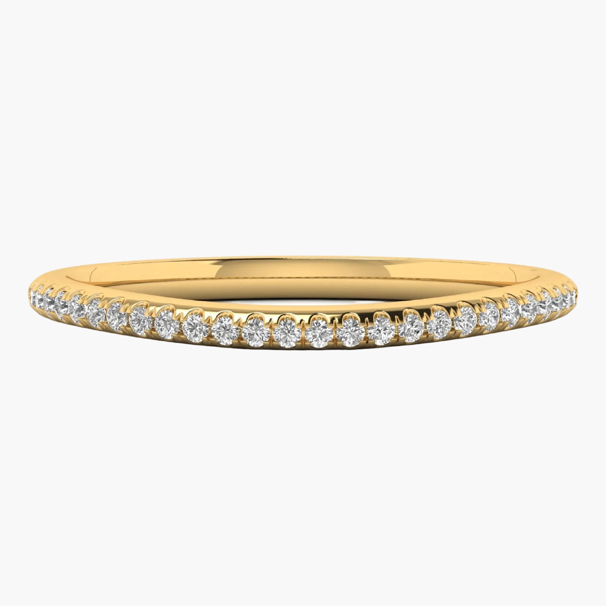 Gold ring with small diamonds on a white background