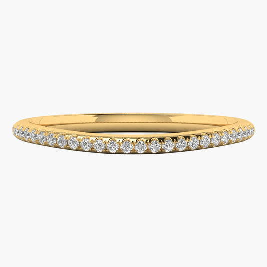 Gold ring with small diamonds on a white background