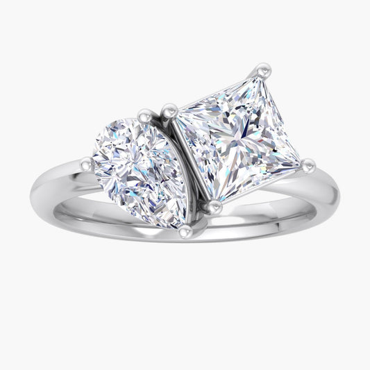 Diamond ring with two prominent diamonds on a white background