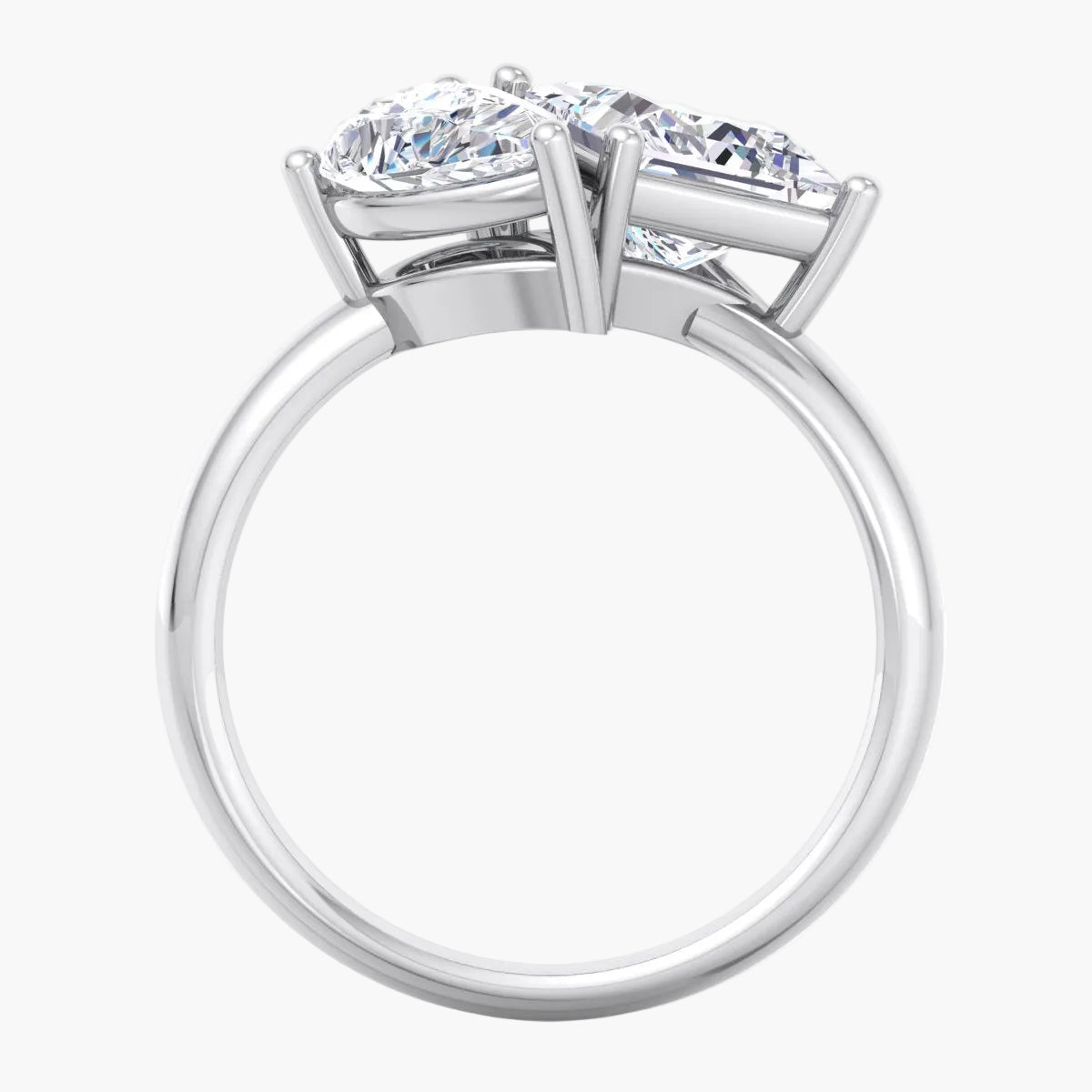 Diamond ring with two prominent gemstones on a white background