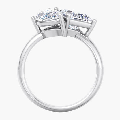Diamond ring with two prominent gemstones on a white background