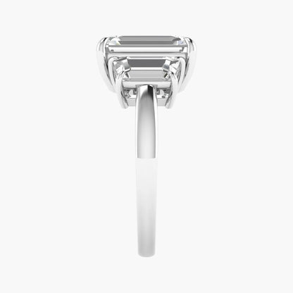 Diamond ring with emerald-cut gemstone on a white background