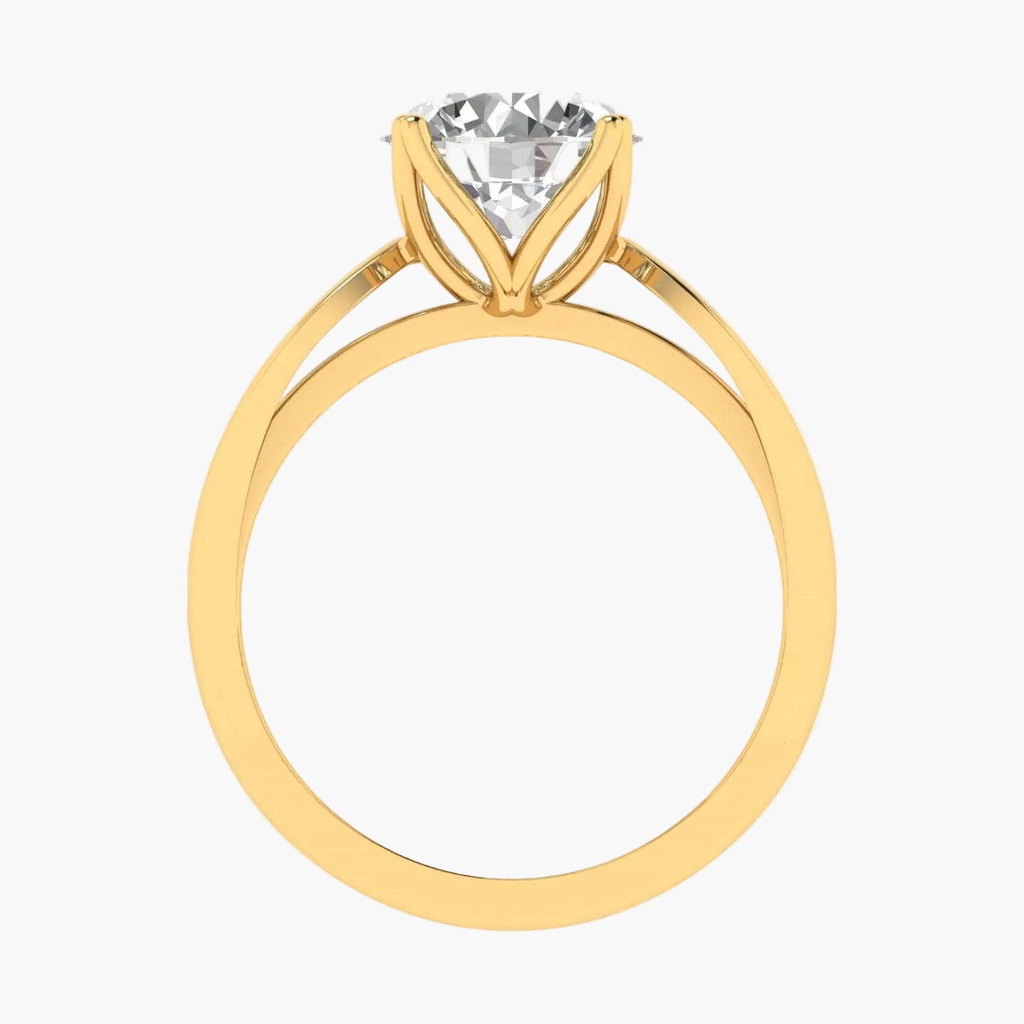 Gold ring with a clear gemstone on a white background