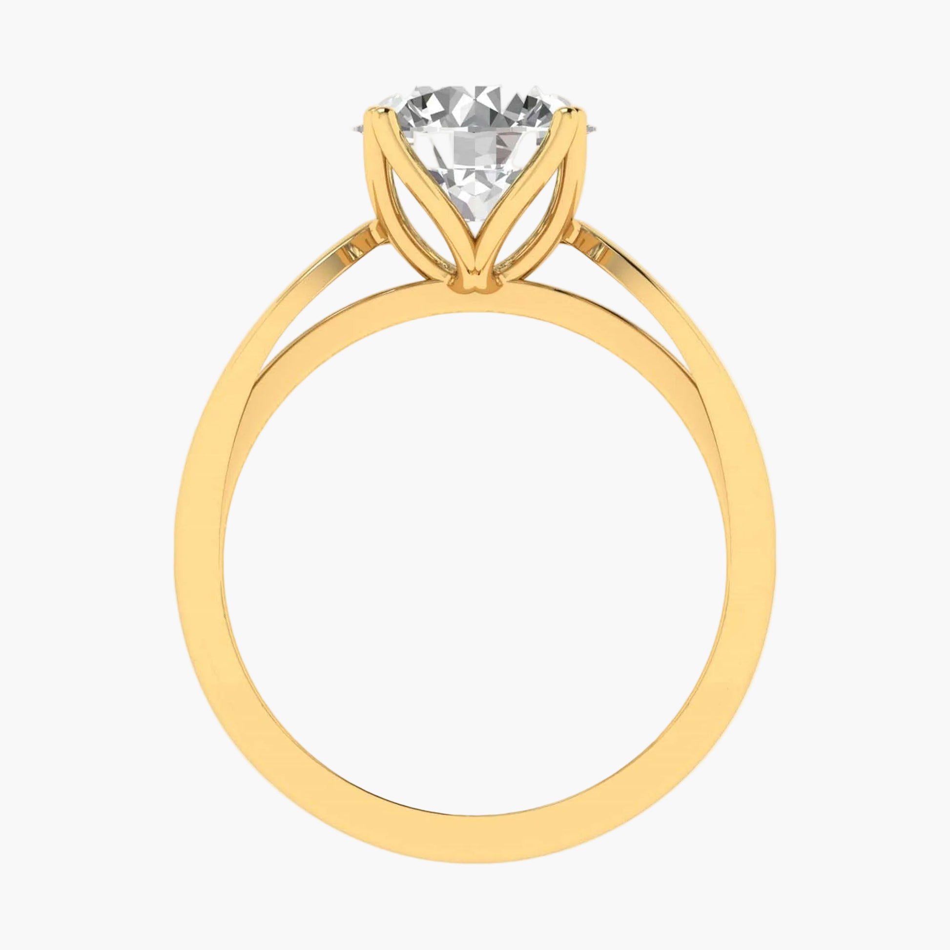 Gold ring with a clear gemstone on a white background
