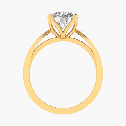 Gold ring with a clear gemstone on a white background