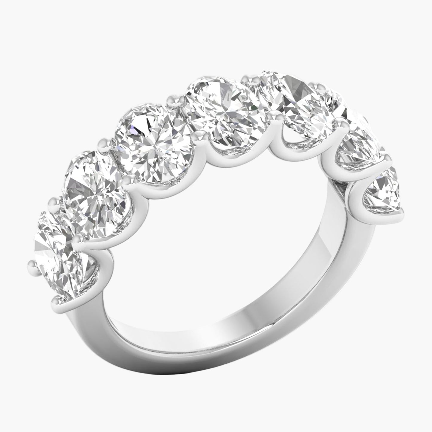 Diamond ring with seven round-cut diamonds on a white background