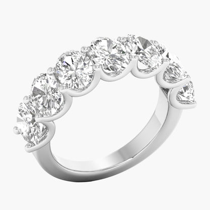 Diamond ring with seven round-cut diamonds on a white background