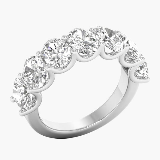 Diamond ring with seven round-cut diamonds on a white background