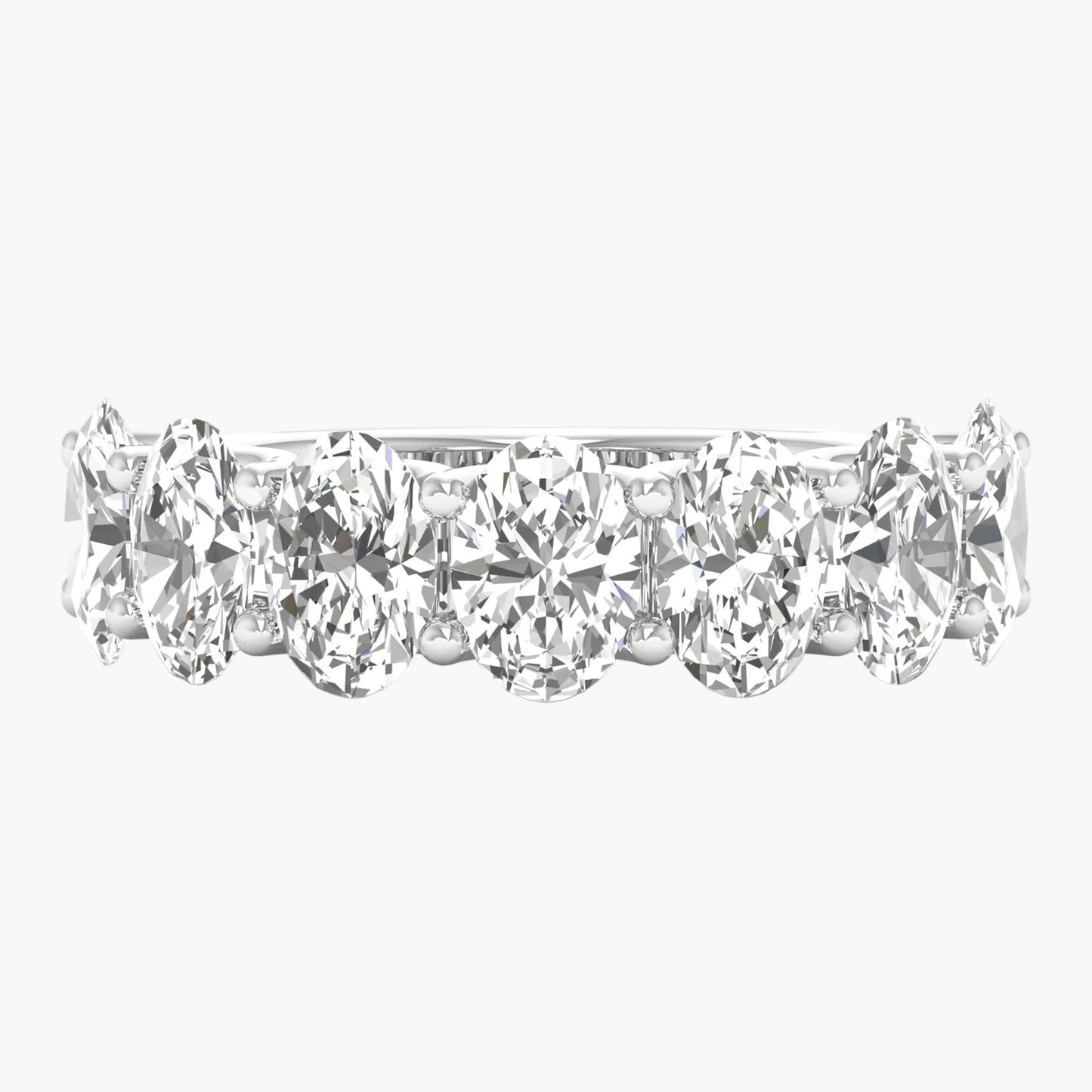 Black metal manifold with multiple ports on a white background
