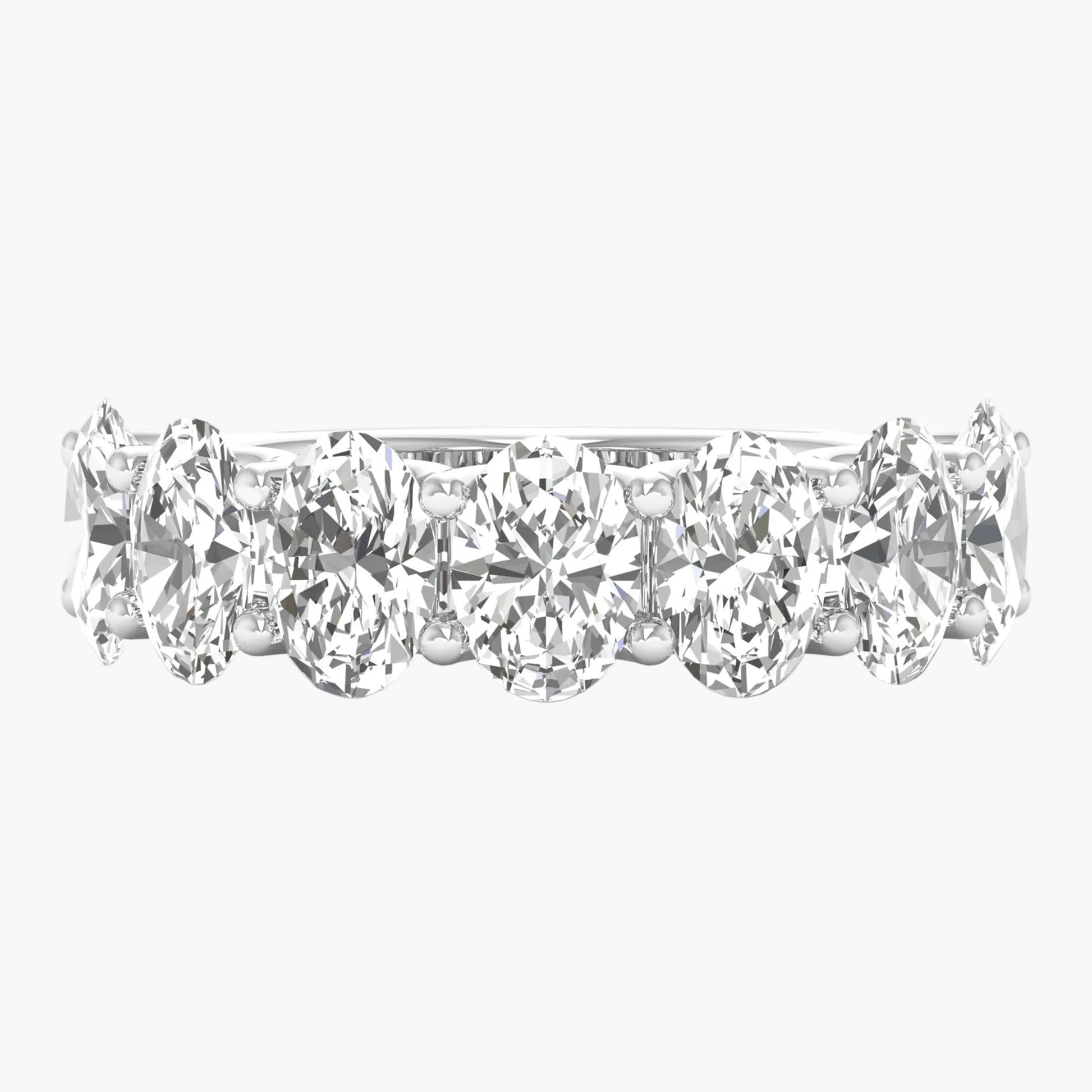 Black metal manifold with multiple ports on a white background