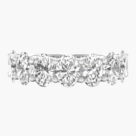 Black metal manifold with multiple ports on a white background