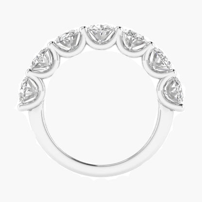 Silver ring with pear-shaped diamonds on a white background