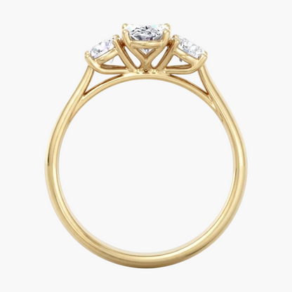 Gold ring with three diamonds on a white background