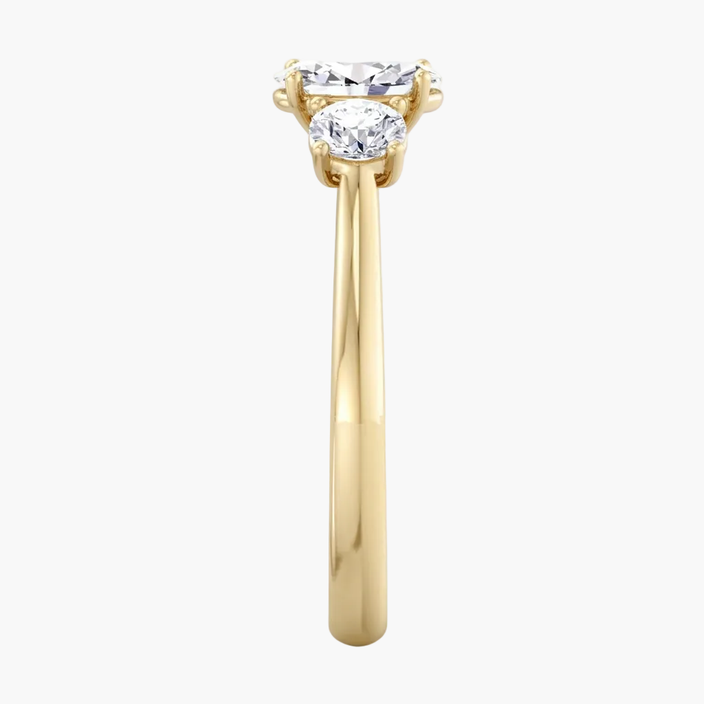 Gold ring with a diamond on a white background