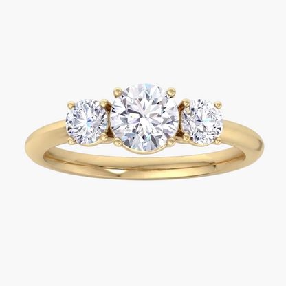 Gold ring with three diamonds on a white background