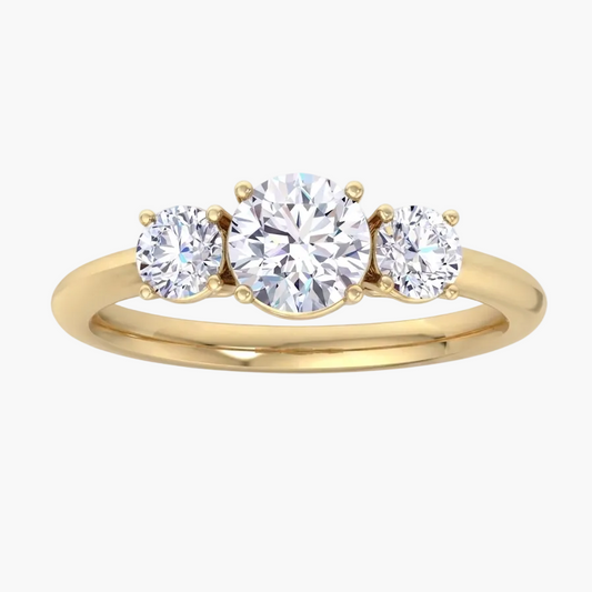 Gold ring with three diamonds on a white background