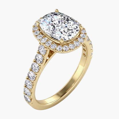 Gold ring with a large central diamond and smaller diamonds on the band against a white background