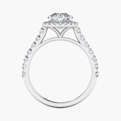 Diamond ring with a halo and smaller diamonds on a white background