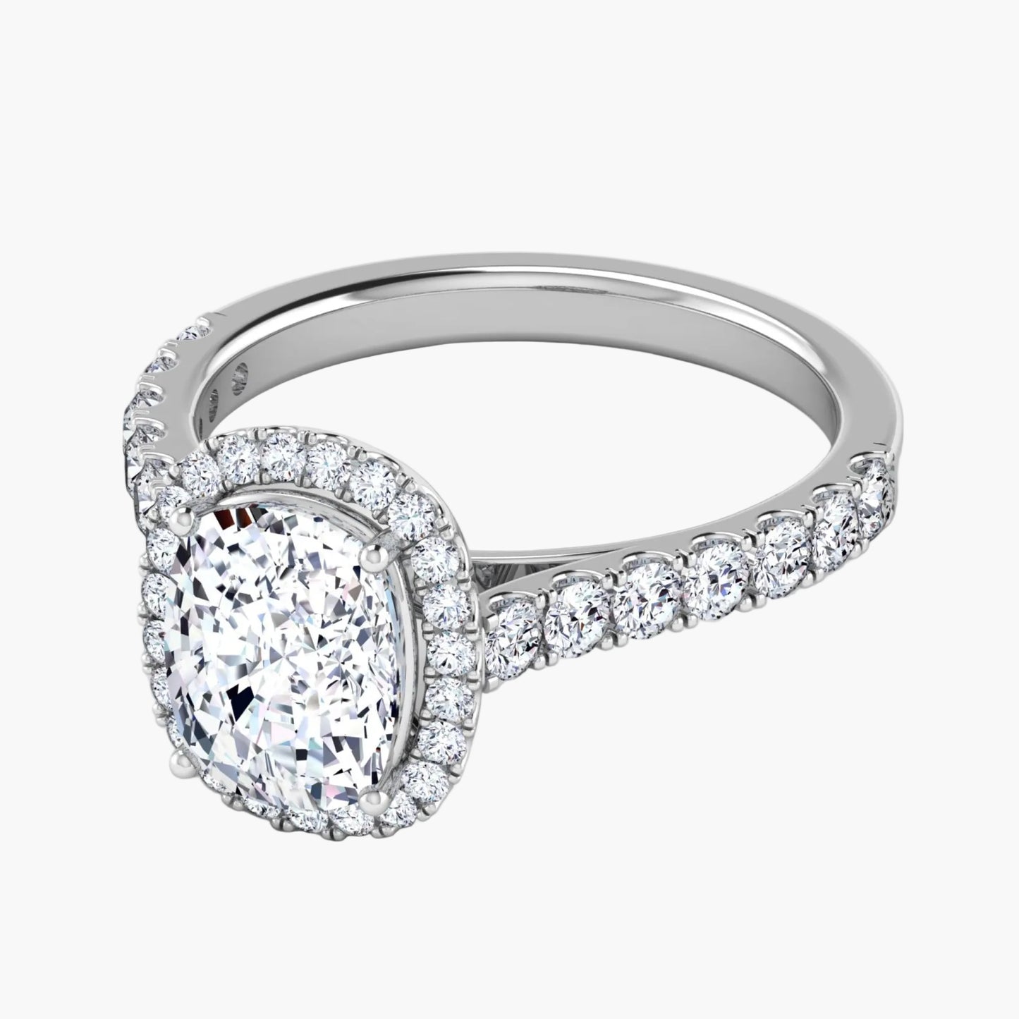 Diamond ring with a pear-shaped center stone on a white background