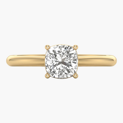 Gold ring with a large diamond on a white background