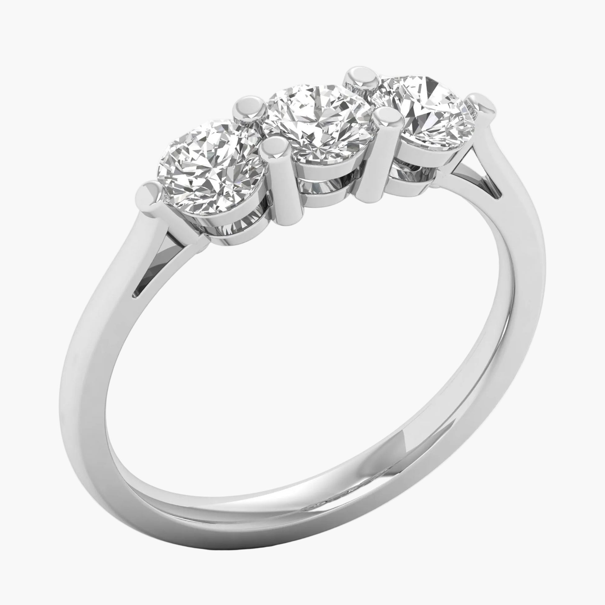 Diamond ring with three stones on a white background
