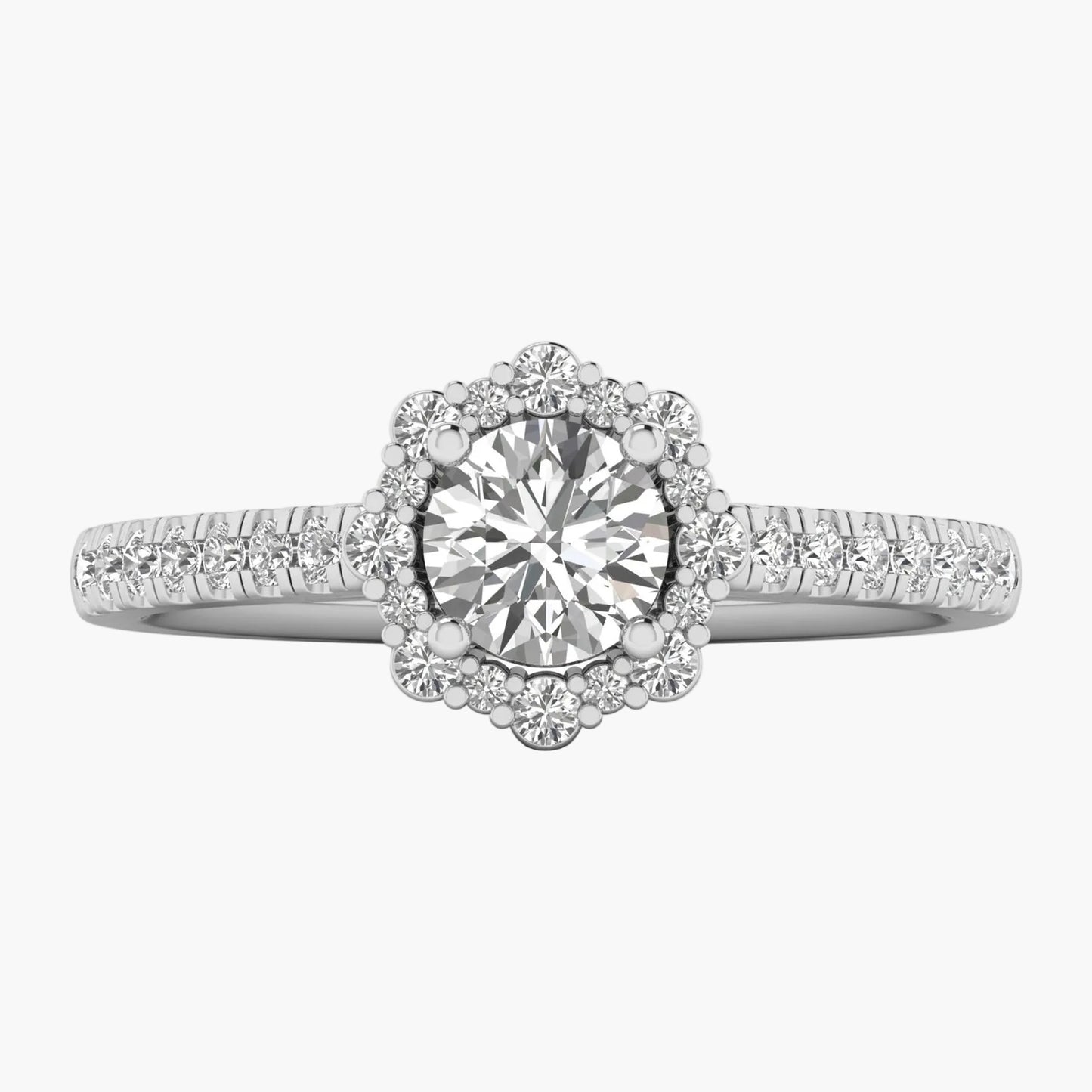 Diamond ring with a halo and side stones on a white background