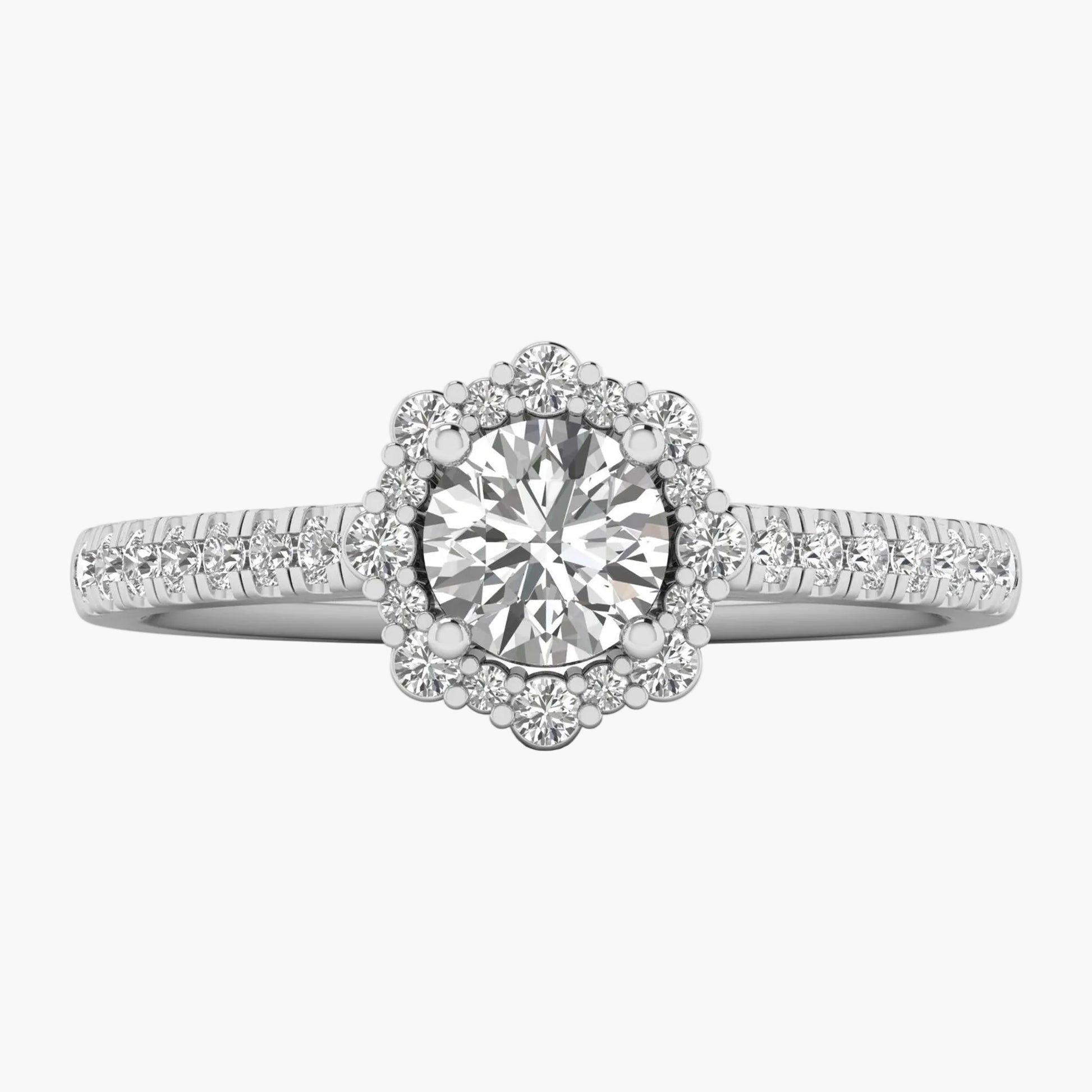 Diamond ring with a halo and side stones on a white background