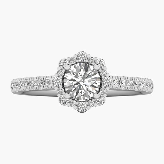 Diamond ring with a halo and side stones on a white background