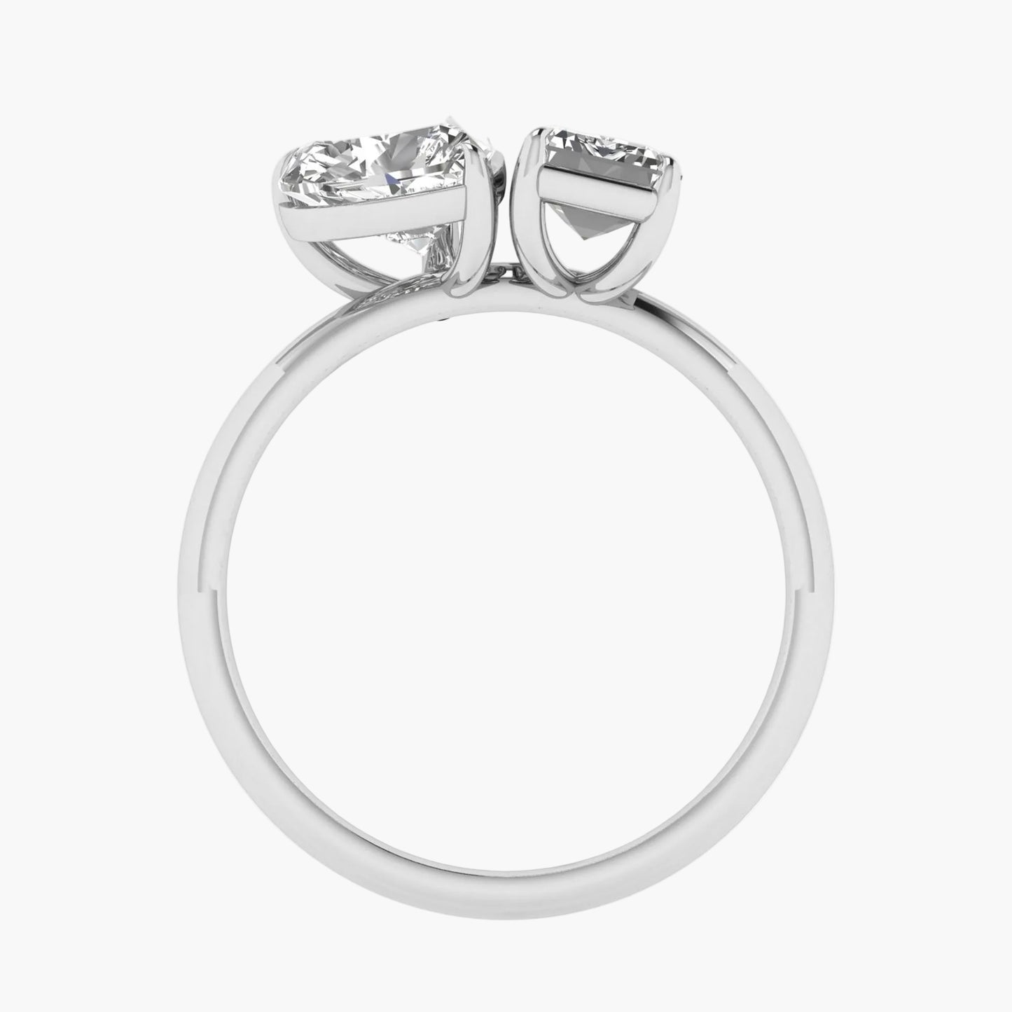 Diamond ring with two gemstones on a white background