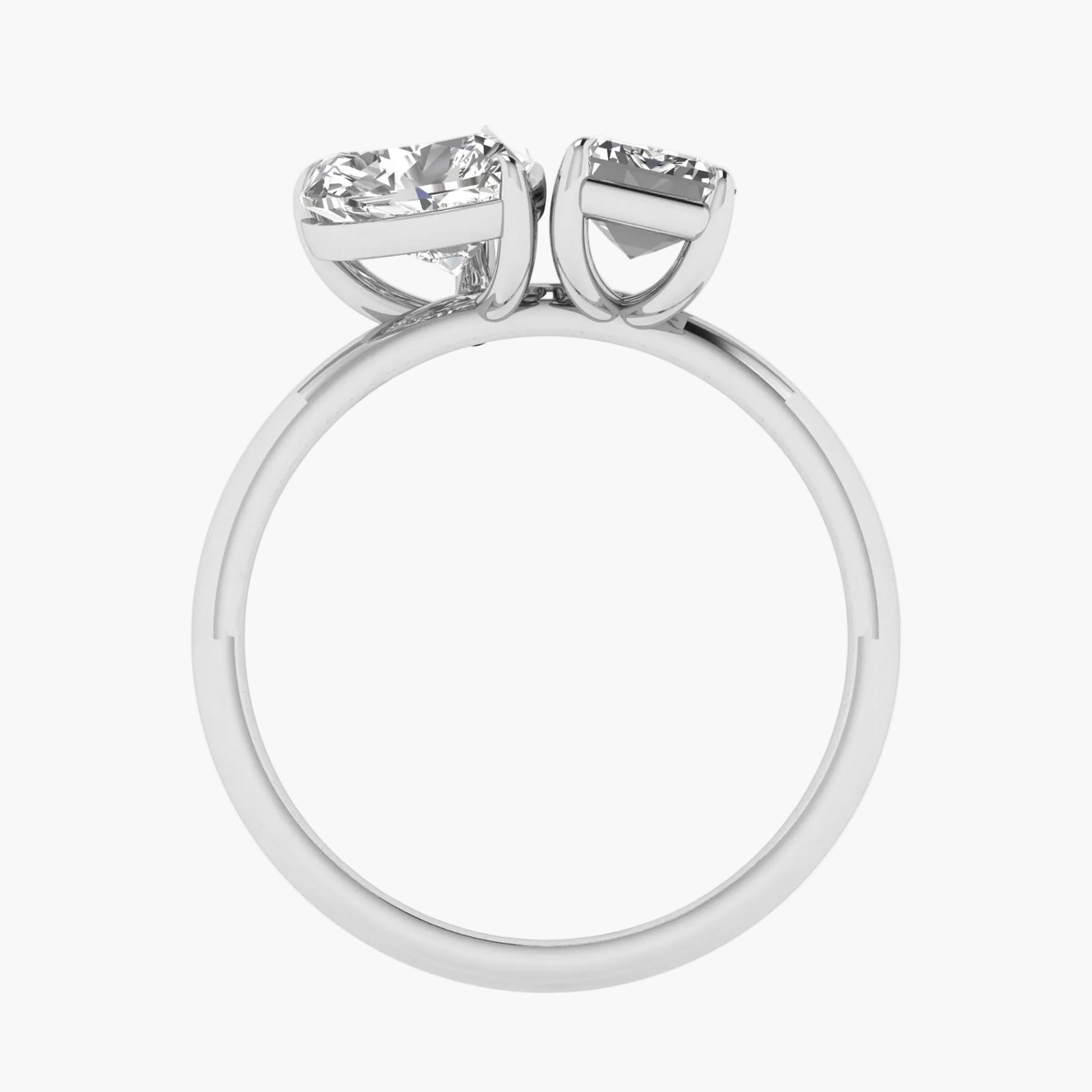 Diamond ring with two gemstones on a white background
