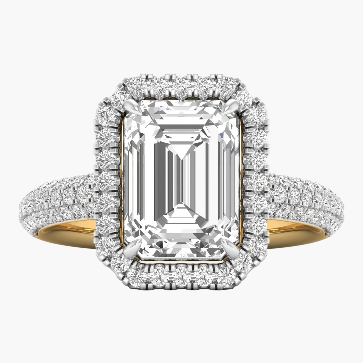 Diamond ring with emerald-cut center stone and halo on a white background